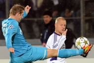 FC Zenit St Petersburg's Tomas Hubocan (L) vies with RSC Anderlecht's Olivier Deschacht (R)